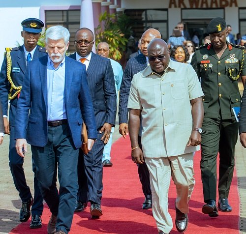 Mr Julius Debrah (right) and other ministers of state ushering President Petr Pavel to onboard his flight