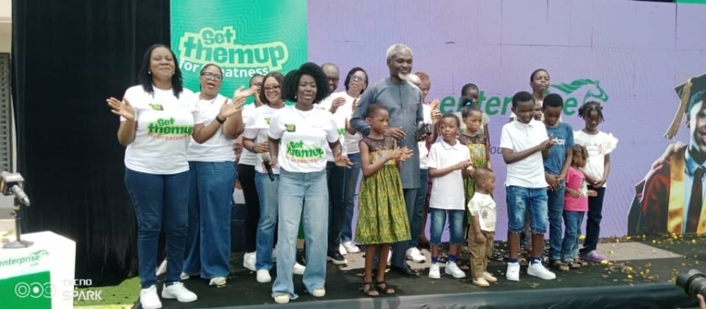 • Mrs Benyi (fifth from left) with some of the management staff of the company, parents and children during the launch