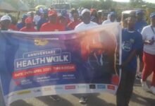 • Dr Edward Ackah Nyamike in white leading the walk in Ho