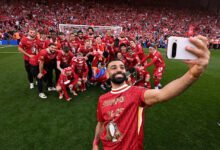 • Liverpool's Salah takes a selfie with his team-mates