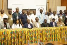 • Messrs Adams and Akpokavie (seate• Md r Mike Aggrey • Mr Frederick Lartey Otu fifth, sixth from right) with both new and past executives of the GOC after the Congress