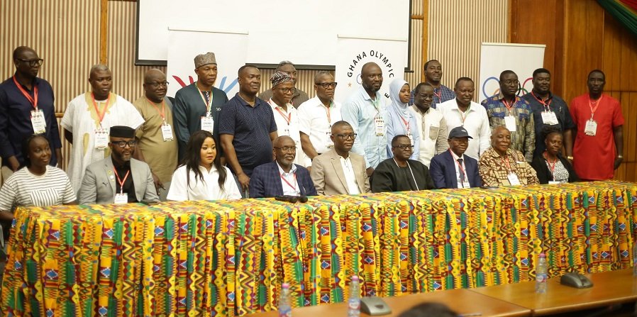 • Messrs Adams and Akpokavie (seate• Md r Mike Aggrey • Mr Frederick Lartey Otu fifth, sixth from right) with both new and past executives of the GOC after the Congress
