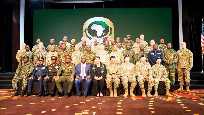 • Mr Omane Boamah (seated fourth from left) flanked by Ms Virginia Palmer and Brig. Gen. William Agyapong