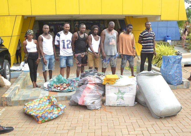 • Some of the suspects behind the siezed drugs Photo: Victor A. Buxton