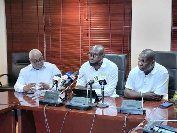•Mr John Darko (middle) speaking at the press conference