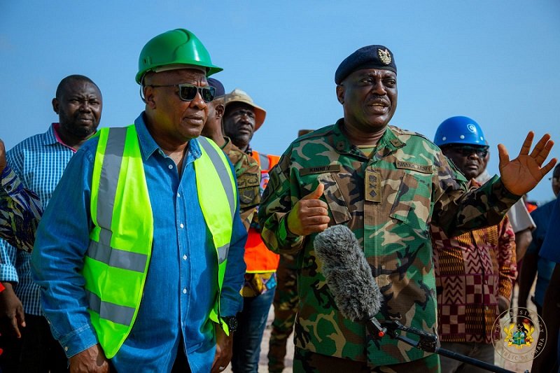 President Mahama (left) being briefed during his tour of flood prone areas in Accra