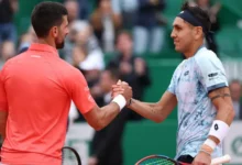 • Tabilo shaking hands with Djokovic aafter his victory
