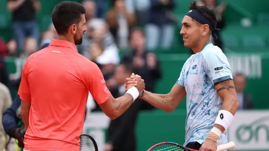 • Tabilo shaking hands with Djokovic aafter his victory