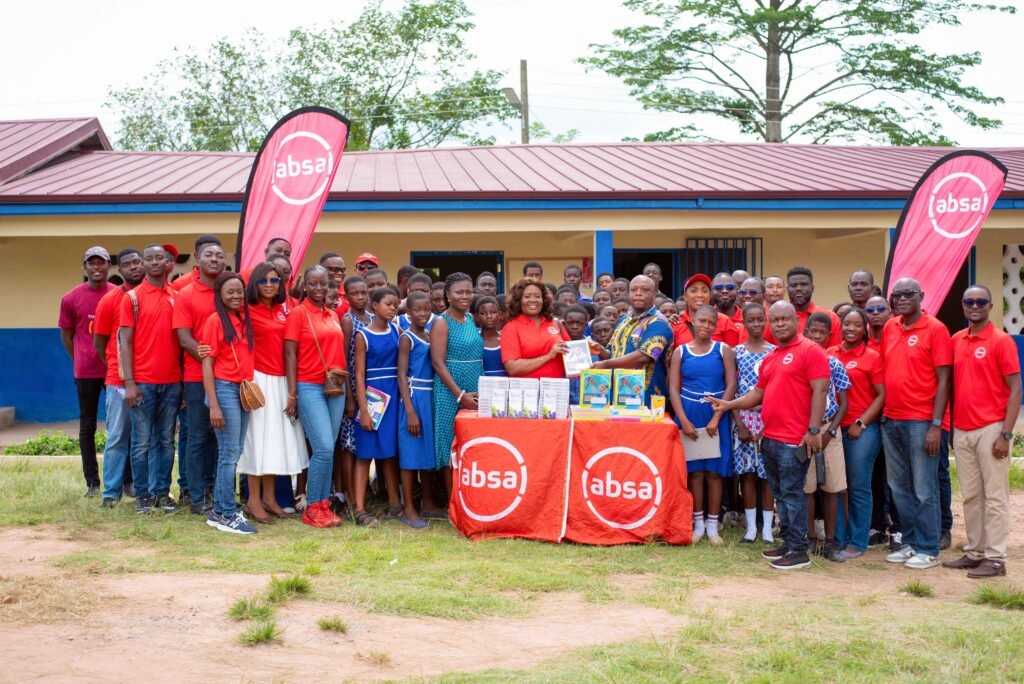 The Absa team with teachers and students of Apirede Presby Basic School
