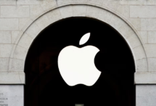 Apple logo is seen on the Apple store at The Marche Saint Germain in Paris, France July 15, 2020. REUTERS/Gonzalo Fuentes/File Photo Purchase Licensing Rights