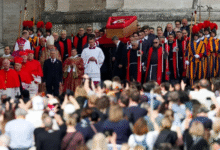 • The pontiff's body, laid out in an open coffin, was moved to the church in a formal procession