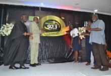 • Dr Ampofu (second from left) with Mr Paa Rock Van Percy (right) and other dignitaries after unvailing the anniversary logo Photo Victor A. Buxton