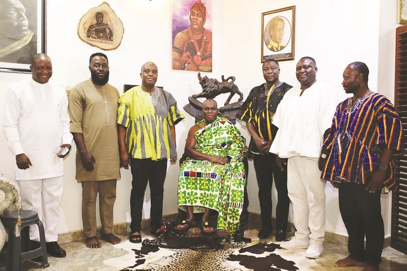 • Mr Clemence Gyato (standing second from right) with Omanhene Odeneho Kwafo Akoto III (seated) and other stakeholders