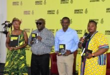 Ms Charity Batuure (right) and Ms Genevieve Partington with other partners launching the report Photo: Seth Osabukle