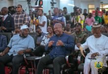 • President Mahama (middle) in a chat with Mr George Opare Addo (left) during the programme