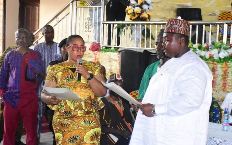 Ms Linda Ocloo swearing in Mr Haruna Mohammed Awal into office Photo Seth Osabukle