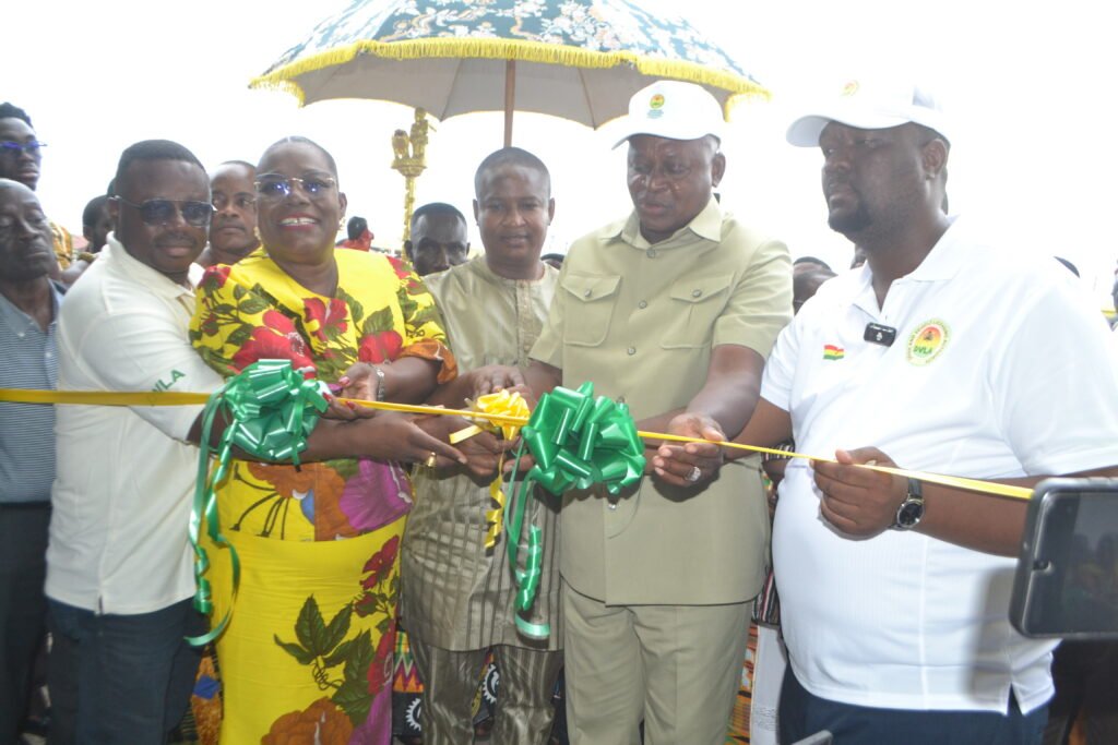 • Mr Joseph Nikpe (second from right) being assisted by Nana Oyi Bampoe Addo (second from left) and Mr Julius N. Kotey (right) to cut the tape for the inauguration of the office Photo: Victor A. Buxton
