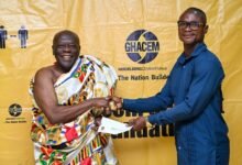 • Ehunabobrim Prah Agyensaim VI, handing over cement allocation chit to representative of a beneficiary institution