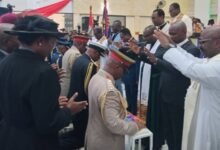 • A word of prayer being said by the clergy for members of the Military High Command during the induction service