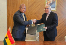 • Mr Samuel Okudzeto Ablakwa (left) exchanging the agreement document with Mr Ahmed Attaf