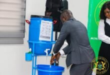 • Mr Akandoh demonstrating proper handwashing at the launch