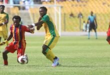 • Hearts Mohammed Hussein (left) and Albert Amoah in a battle for the ball
