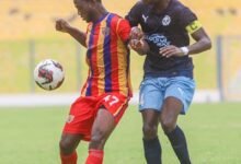 • Hearts Kwesi Asmah controling the ball away from his Accra Lions marker Issa Ibrahim (right)