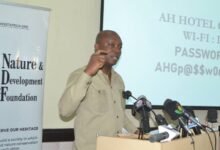 Dr Brown (inset) speaking at the event Photo: Victor A Buxton