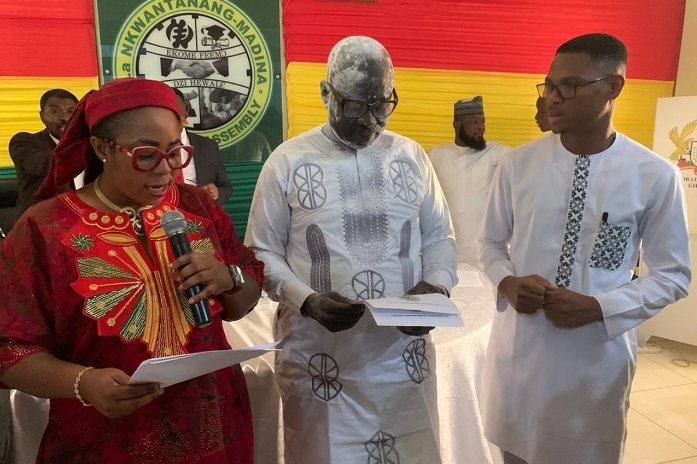 Ms Linda Ocloo (left) swearing in Mr Ibrahim FailaFuseini (middle).Looking on is Mr Francis-Xavier KojoSosu