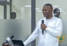 • Mr Adams (Inset) and the participants after the programme