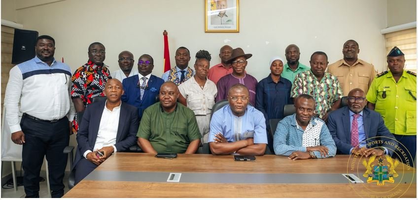 • Mr Kofi Adams (seated middle) with staff of the ministry and members of the GOC
