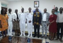 • Mr Wumborti (fourth from right) with Rear Admiral Bessing (fifth from left) and other dignitaries after the visit