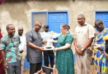 • Ms Penny Dennis(right), deputy Australian High Commissioner handing presenting the keys to Mr Tetteh Padi