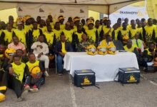 The Okada riders with officials form Gold Coast Mobility Innovation