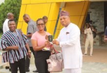 • Ms Efe Ankrah (middle) receiving the passport from Mr Samuel Okudzeto Ablakwa (right) on behalf of her daughter at FDA Headoffice in Accra Photo: Ebo Gorman