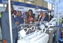 • Mr Samson Ahi (second from left) at one of the exhibition stands during the programme Photo: Victor A. Buxton