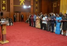 • President Mahama (left) swearing in the members