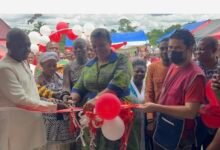 Inset, Ms Tetteh-Agbotui (middle) being assited by other dignitaries to cut the tape for the inauguration of the clinic