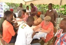 • Rev. Dr Quarshie (standing right) observing the registration process for the trainees Photo: Victor A. Buxton