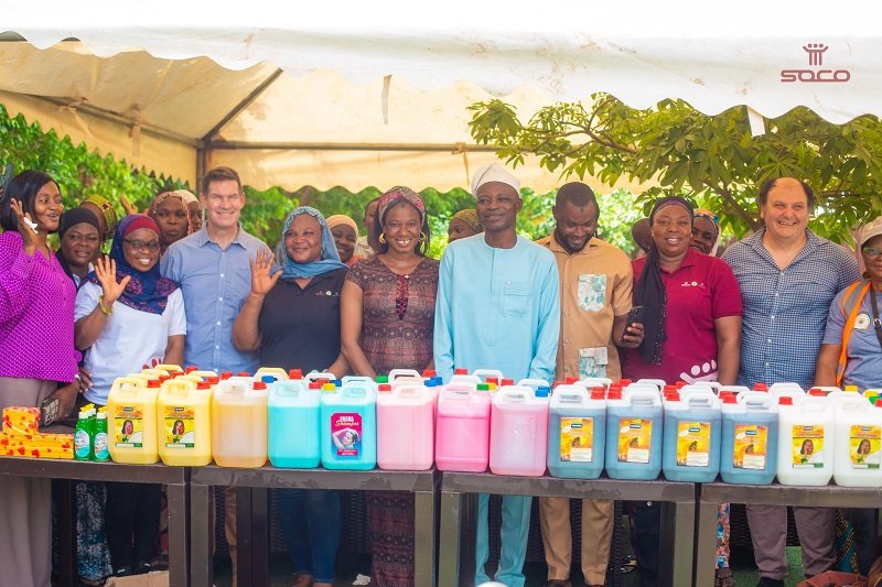 Mr Ali Adolf John Mburudiba (middle) and Mr Robin Mearns with some SOCO beneficiaries