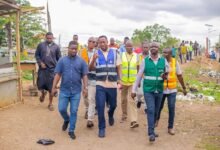 • Inset: Mr Frank Nkansah (second from right) with the taskforce inspecting some areas in the district