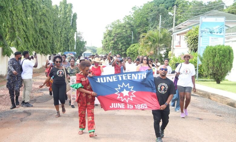 Members of AAAG and staff of GTA during the parade to commemorate Juneteenth