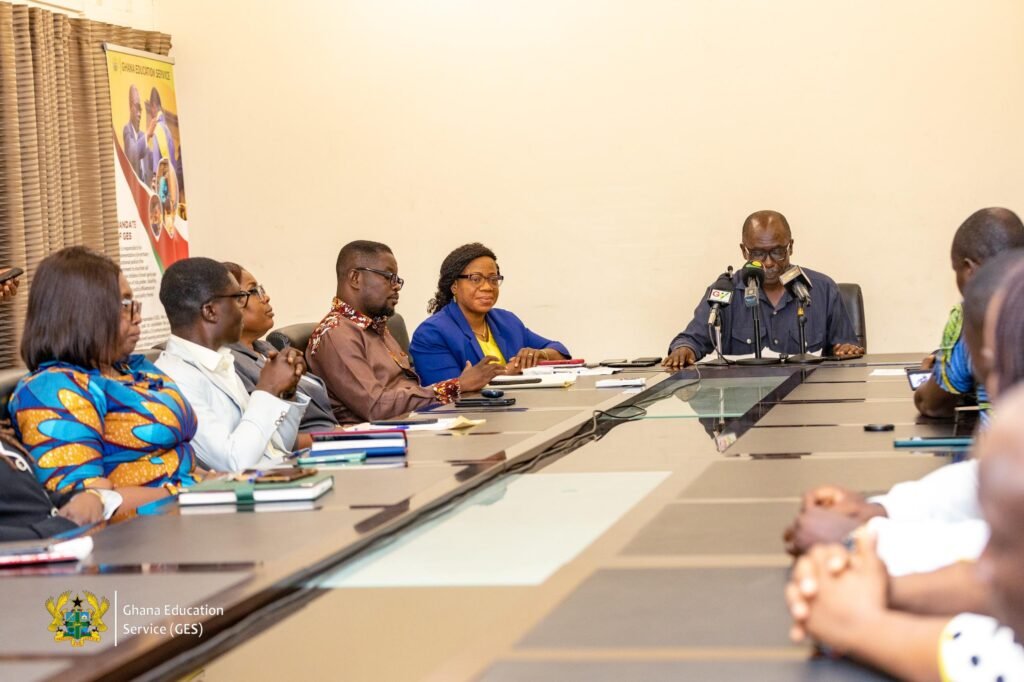 • Prof. Ernest Kofi Davis (middle) addressing journalists