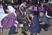 Mr Eric Opoku (second from left) in discussion with some Chinese participants during the summit Photo Victor A. Buxton