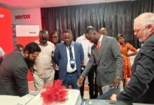 Mr. Alhassan (second from right) explaining the function of the machine to some industry players