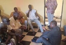 • Mr Roland Atanga Ayoo (sitting on the floor) exchanging pleasantries with the Regent and elders at Soe
