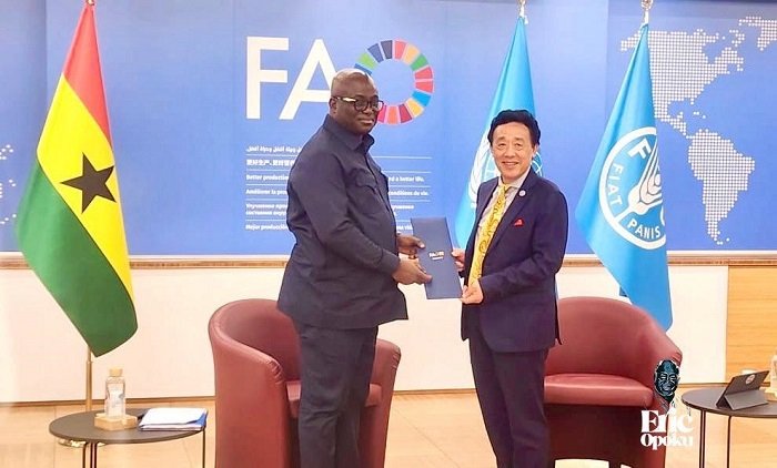 • Mr Eric Opoku (left) and Dr QU Dongyu with the document