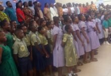 • Pupils and students with dignitaries after the programme