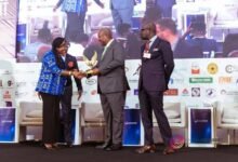 Mrs Arthur receiving her honour from President John Dramani Mahama