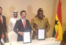 • Mr Sam George (right) and Sultan Sulayem displaying the signed documents